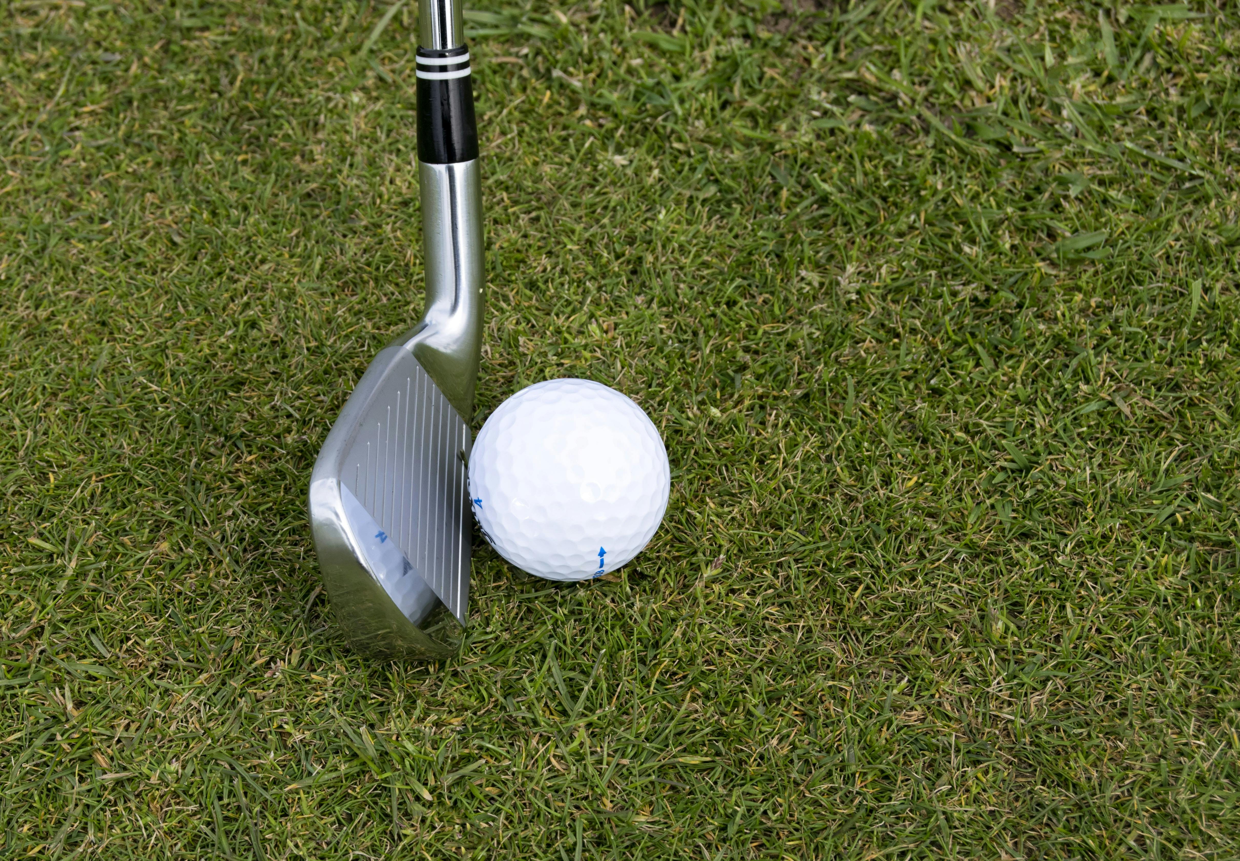 Golf ball near golf club